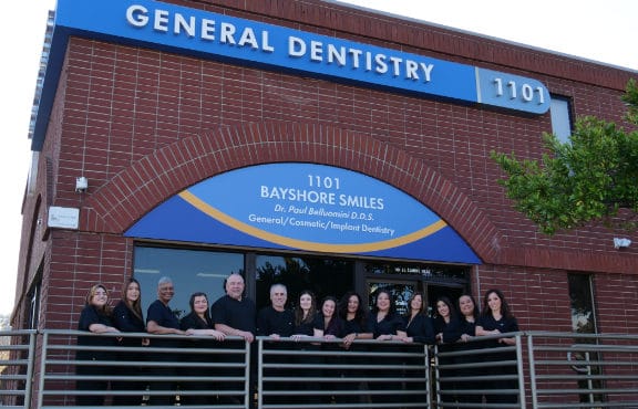 Team photo in front of the office building