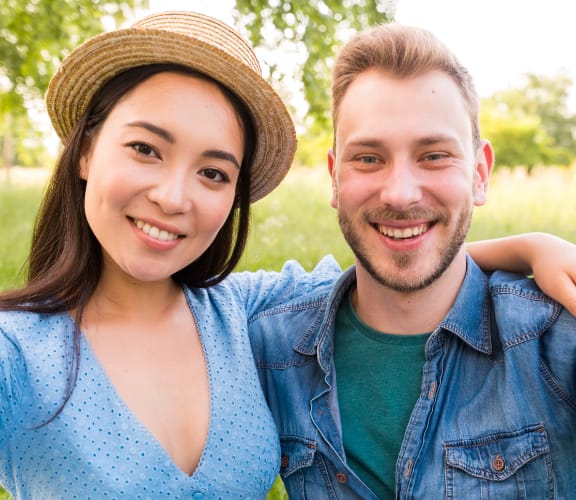 Young couple taking a selfie in a field