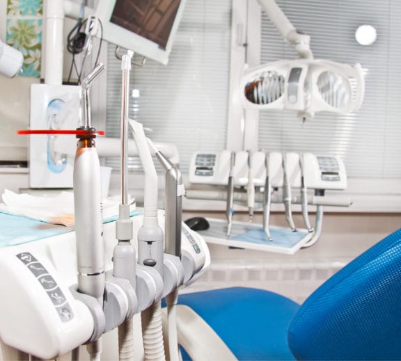 CLose up of dental tools including a tootl used for high volume suction